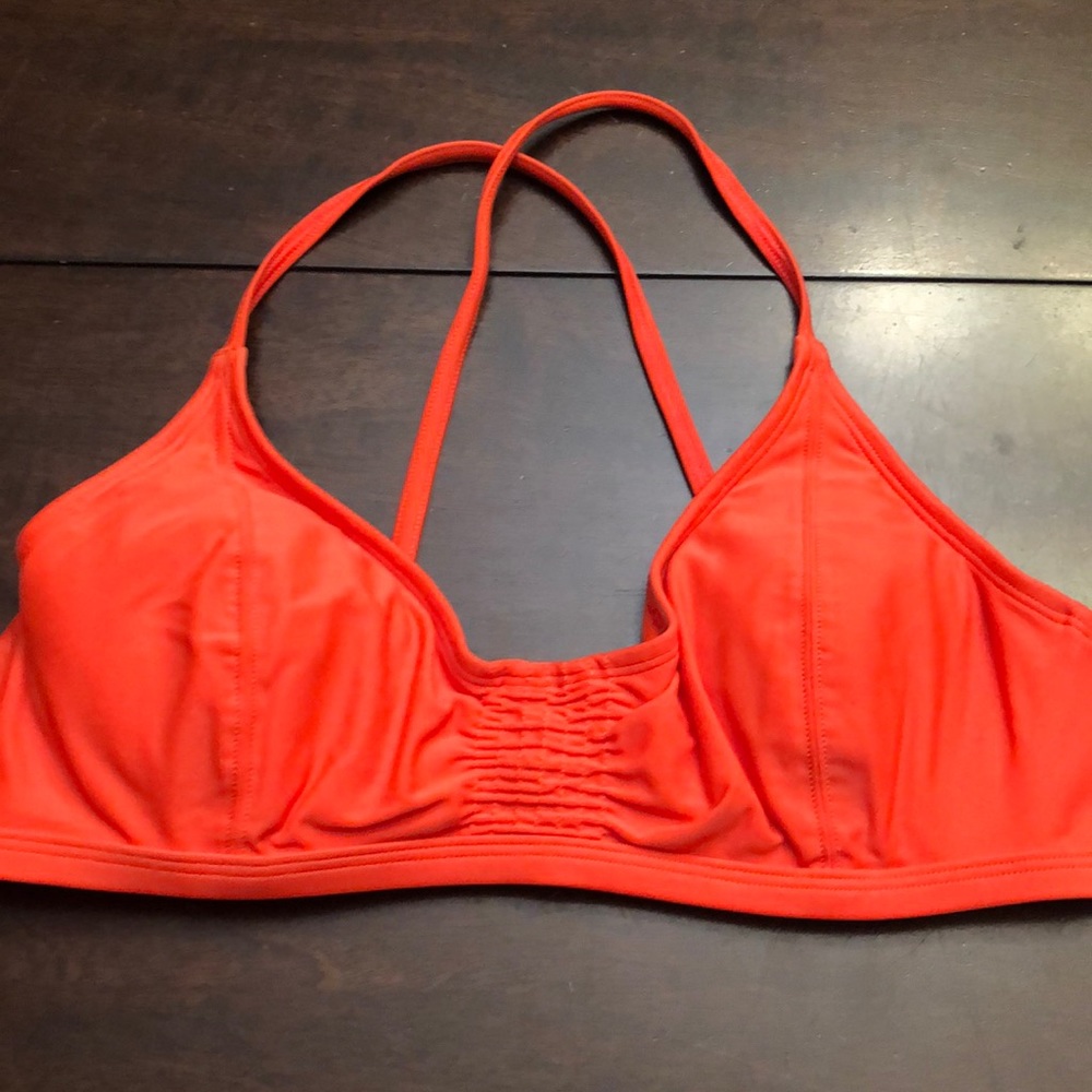 Athleta swim top.  Orange.